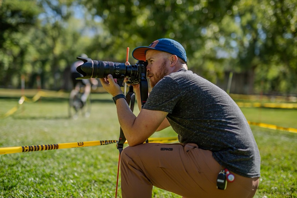 A photo of Sawyer photographing a cycling event